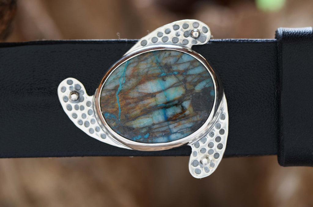 Stunning silver Belt Buckle featuring well-figured blue Chrysocolla stone. Shone with a black leather belt.